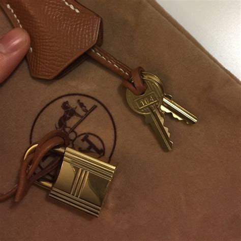 authentic hermes lock and key